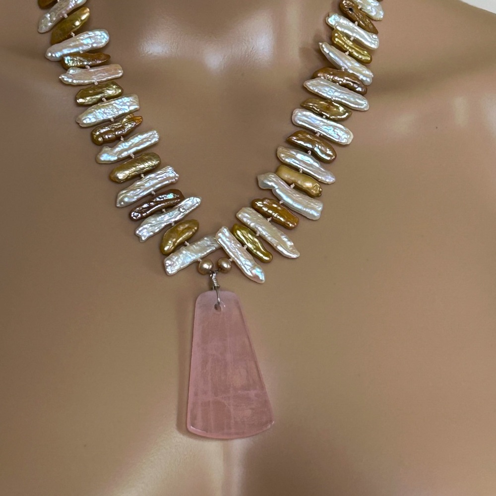 Necklace with a 2 inch rose quartz pendant and ‘Mother of  Pearl’ chain.